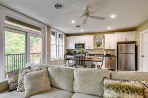a living room with a couch and a kitchen at Luxurious Litfin Loft - Walk to Main St Akron in Akron