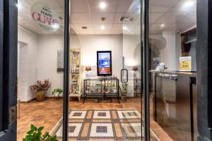 a store with a glass door in a store at Hotel & Spa Golden Barcelona in Vallromanas +152 photos