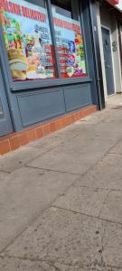 a building with a sign on the side of it at Quality Rooms in Liverpool