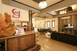 a lobby with a waiting area with a waiting room at INg Hostel in Hualien City