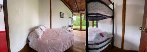 Giường trong phòng chung tại ShantihOMe Ecolodge entre Mindo y San Miguel de los Bancos Ecuador