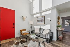 a living room with a red door at Quarry A28 in Whitefish