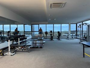 a gym with a view of the ocean at Condo sea view rawai beach by phuket sweet home in Rawai Beach +10 photos