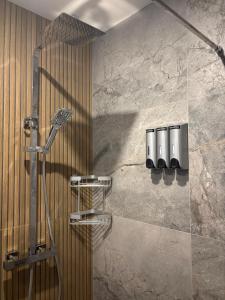 a shower in a bathroom with a shower at Stoneywood Haven, Galway in Clarinbridge