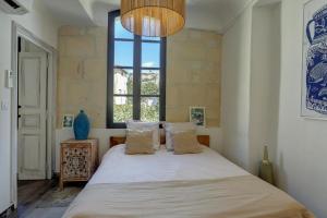 Ένα ή περισσότερα κρεβάτια σε δωμάτιο στο HP2 Magnifique appartement dans HP les Oliviers-2