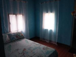 Ένα ή περισσότερα κρεβάτια σε δωμάτιο στο Faldas Guesthouse