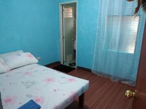 Ένα ή περισσότερα κρεβάτια σε δωμάτιο στο Faldas Guesthouse