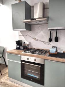 a kitchen with a stove and a counter top at Verona Dreams in Verona