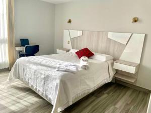 Ένα ή περισσότερα κρεβάτια σε δωμάτιο στο Hotel Florez Boutique