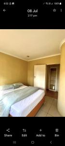 a picture of a bedroom with a large bed at Villa La Maison in Pretoria