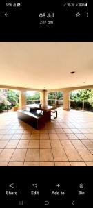 a screenshot of a picture of a patio with a bench at Villa La Maison in Pretoria