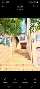 a picture of a staircase in front of a building at Villa La Maison in Pretoria +2 photos