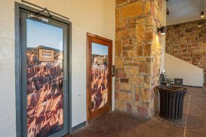 a door to a building with a sign on it at Newly Updated Cozy Escape Close to Ski Lifts in Brian Head