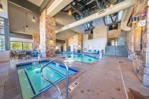 a large indoor swimming pool in a building at Newly Updated Cozy Escape Close to Ski Lifts in Brian Head