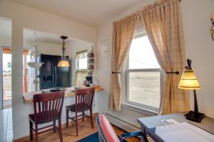 a kitchen with a table and chairs and a window at Red Gates Cottage 3 Miles to University! in Laramie