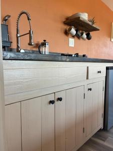 a kitchen with a sink and a counter top at Cabin at the Hill, Close to Big Bend National Park and Terlingua Ghost Town in Terlingua