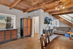 a living room with wooden ceilings and a dining room at The Summit at Sherwood #618 in Big Bear City +12 photos