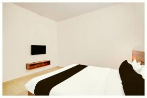 Ένα ή περισσότερα κρεβάτια σε δωμάτιο στο Hotel Brown Inn Residency