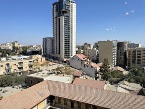 a view of a city with a tall building at Apartment in heart of Jerusalem in Jerusalem