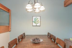 a dining room with a table and chairs at Snowcreek IV 588 in Mammoth Lakes +15 photos