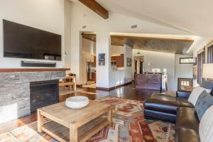 a living room with a couch and a fireplace at Snowcreek V 731 in Mammoth Lakes