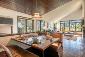a dining room with a table and a couch at Snowcreek V 731 in Mammoth Lakes +41 photos