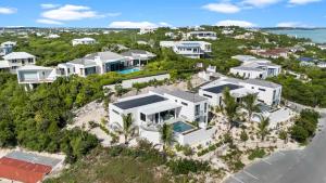 an aerial view of a house on the beach at Villa Jupiter with Private Pool Oceanfront in Turtle Cove
