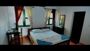 Postel nebo postele na pokoji v ubytování The Paro Homestay Ashtamudi