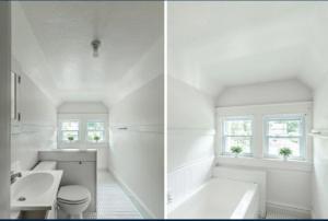 a white bathroom with a tub and a toilet at charming apartment at Lynchburg in Lynchburg