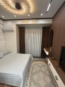 Postel nebo postele na pokoji v ubytování Аренда квартиры #11 NRG U-Tower Rent an apartment