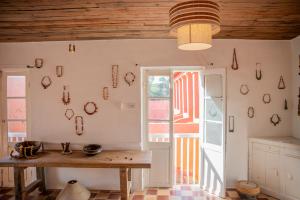 a kitchen with a table and a window at Maison Crespin in Dakar +29 photos