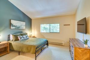 a bedroom with a bed and a television at Cozy Winter Park Condo Bike, Ski, and Hike! in Winter Park +25 photos