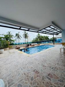 a swimming pool with a view of the water at apartamento 1302 in Cartagena de Indias