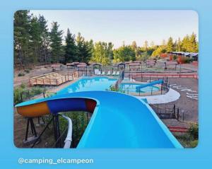 a water park with a water slide in it at Camping Campeon in Salto del Laja