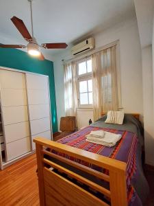 a bedroom with a bed and a window at Habitación privada, solo Damas "Alma de mujer" in Buenos Aires
