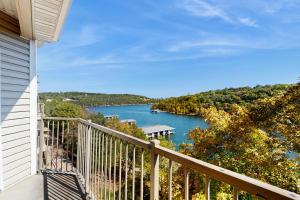 a balcony with a view of a lake at Shoreline Haven in Kimberling City