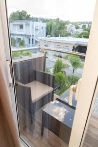 a balcony with a table and a chair and a view at La Isla Royal - Penthouse Suite in Miches