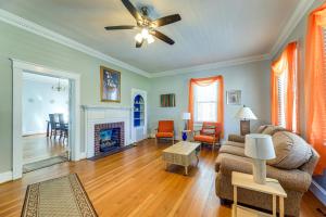 a living room with a couch and a fireplace at 1 Mi to Historic District! Family Home in New Bern in New Bern