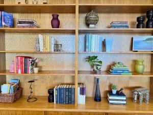a book shelf filled with lots of books at Waterfront Eagle Nest in Nanaimo