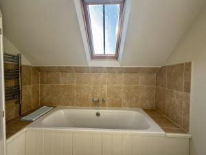 a bath tub in a bathroom with a window at 2 bed in Whitland 43978 in Whitland +16 photos