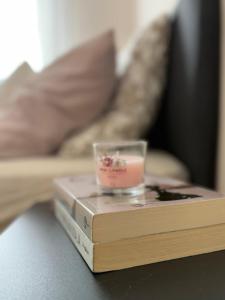a book on a table with a candle on top at Kutak mira in Belgrade
