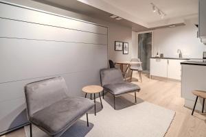 a waiting room with chairs and a table at Staying Apt 6 in Tromsø