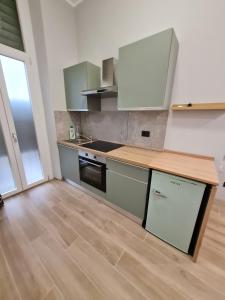 Kuchyň nebo kuchyňský kout v ubytování Moddy's loft