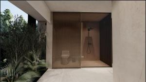 ein Hauseingang mit einem Stuhl im Türrahmen in der Unterkunft Moderno y luminoso apartamento de 3 habitaciones 314 in Medellín