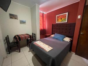 Postel nebo postele na pokoji v ubytování Hospedaje Mayo Huacachina