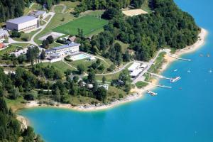 an aerial view of an island in a lake at Maison de campagne Lac de Vouglans in Onoz