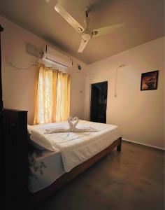 Postel nebo postele na pokoji v ubytování Orchid Home Stay