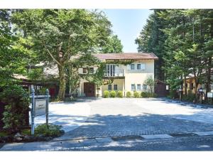 a large house with a driveway in front of it at Auberge de Primavera - Vacation STAY 40780v in Shin-karuisawa