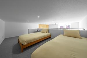 En eller flere senge i et værelse på FURANO RESORT WAKABA E - Vacation STAY 20176