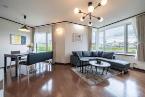 a living room with a couch and a table at SEKKA - Vacation STAY 20179 in Shimo-furano